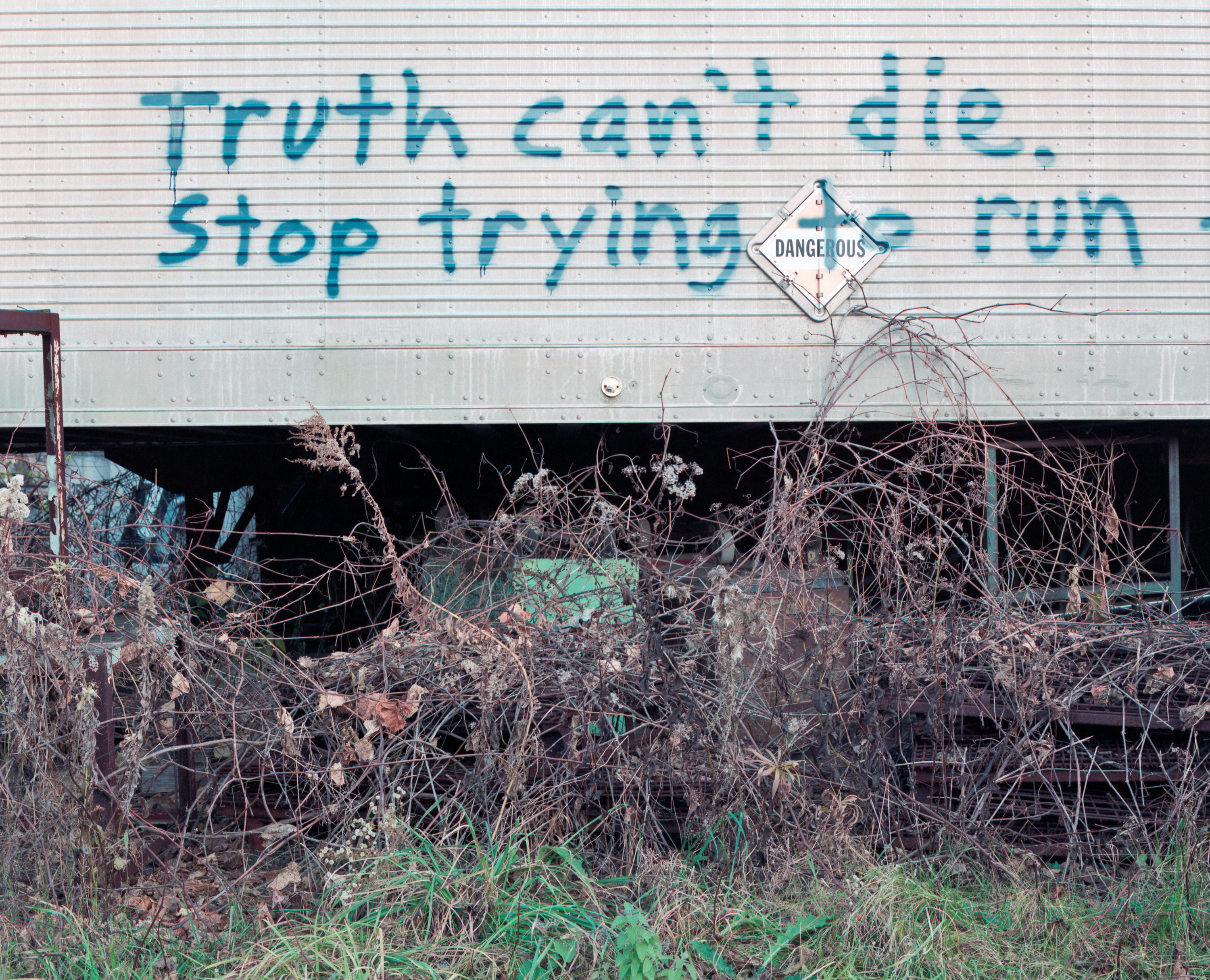 Photograph by Andrew McAllister titled Truth Can't Die Stop Trying to Run